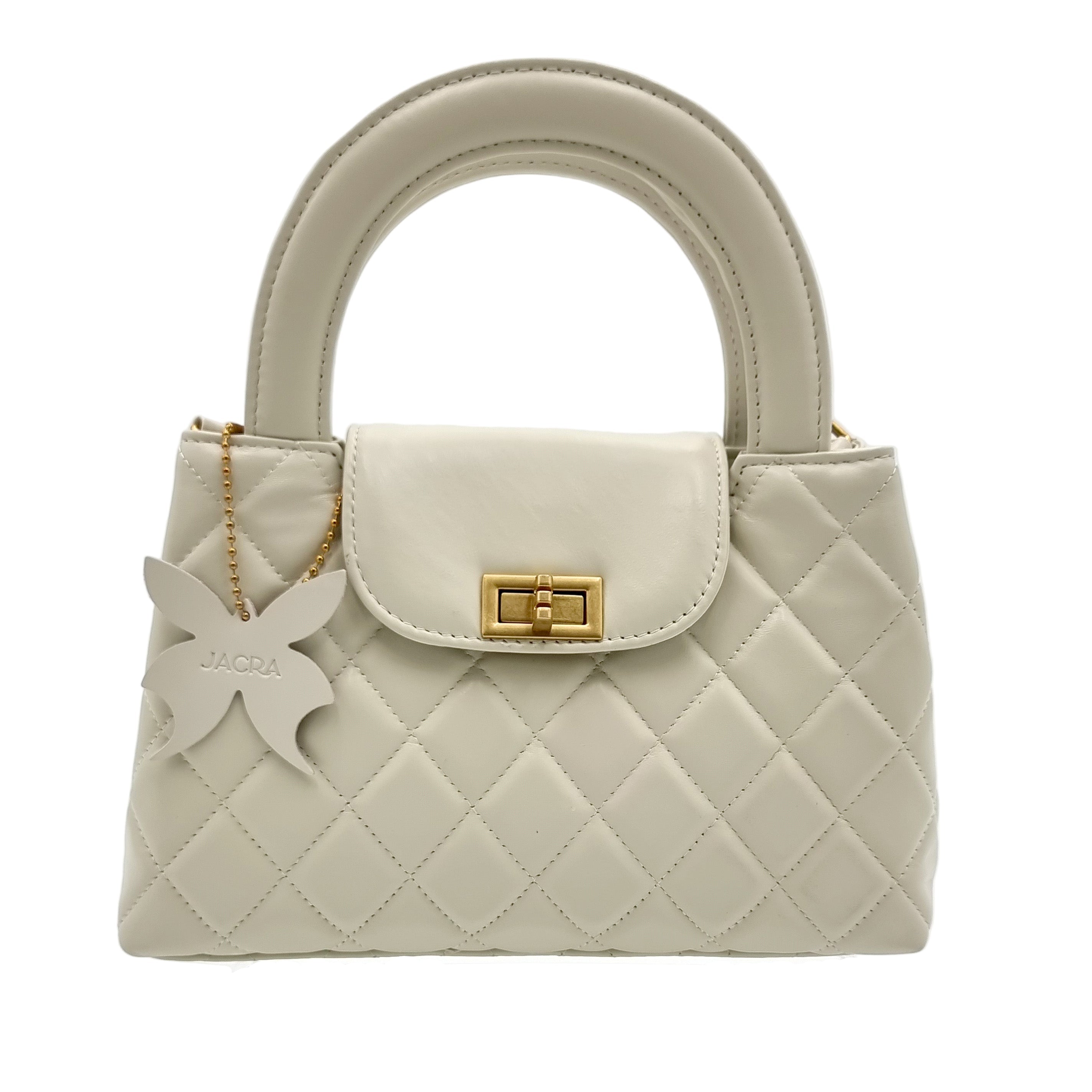 Beige real leather handbag with a butterfly charm and gold accent on a white background